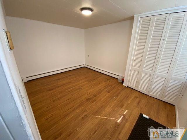 123 Kossuth Street Somerset, NJ 08873 - Photo 2 of 15 a view of empty room with wooden floor