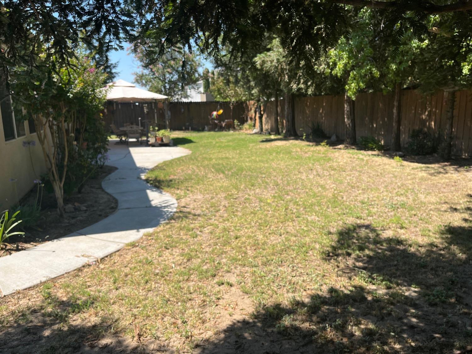 2261 Pillsbury Road Manteca, CA 95337 - Photo 13 of 15 a swimming pool with trees in the background