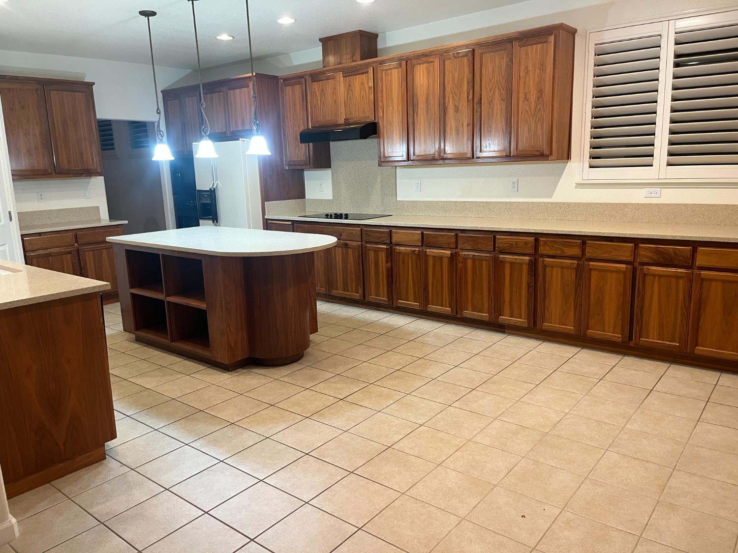 2261 Pillsbury Road Manteca, CA 95337 - Photo 7 of 15 a kitchen with stainless steel appliances kitchen island granite countertop a stove a sink and a microwave