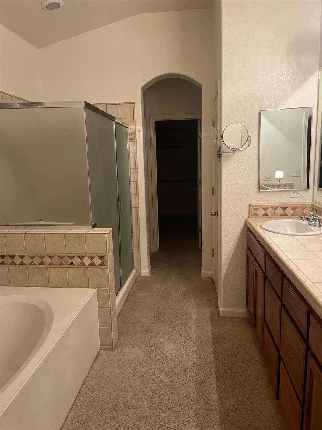 2261 Pillsbury Road Manteca, CA 95337 - Photo 10 of 15 a bathroom with a bathtub sink and mirror