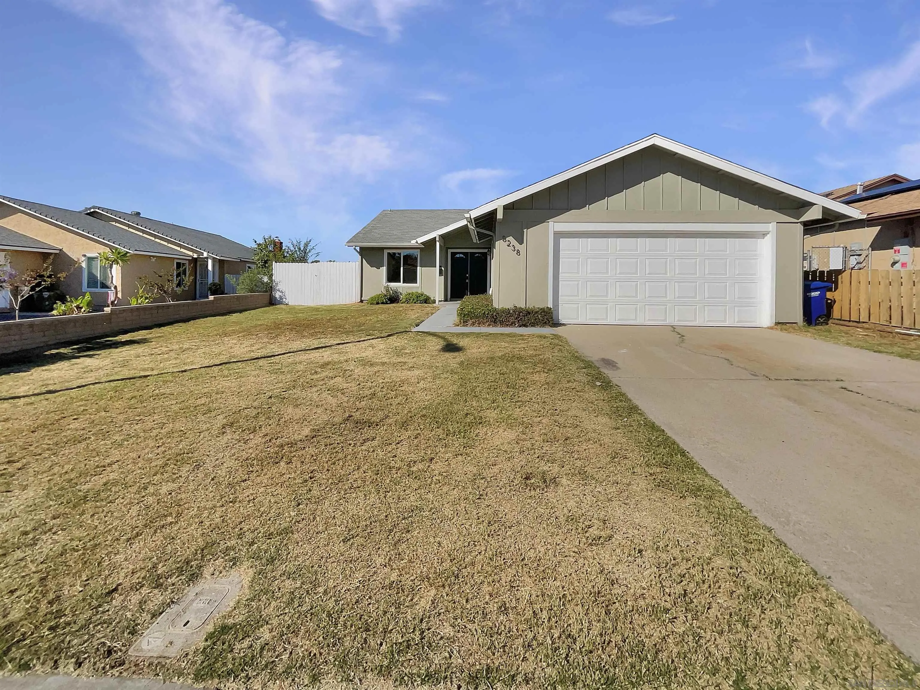 8238 Cacus Street Spring Valley, CA 91977 - Photo 1 of 22 a view of garage yard and front view of a house