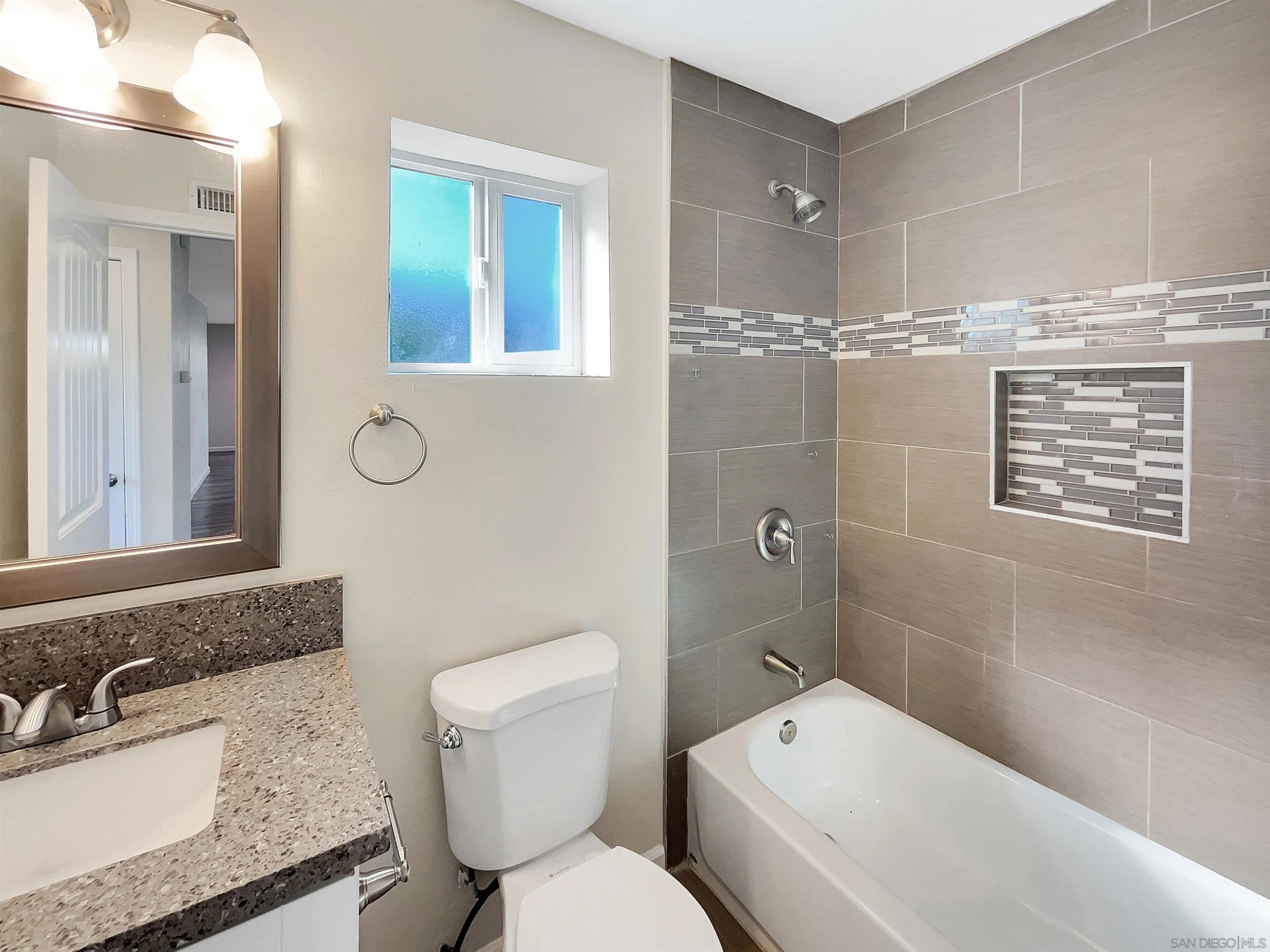 8238 Cacus Street Spring Valley, CA 91977 - Photo 16 of 22 a bathroom with a toilet sink shower and mirror