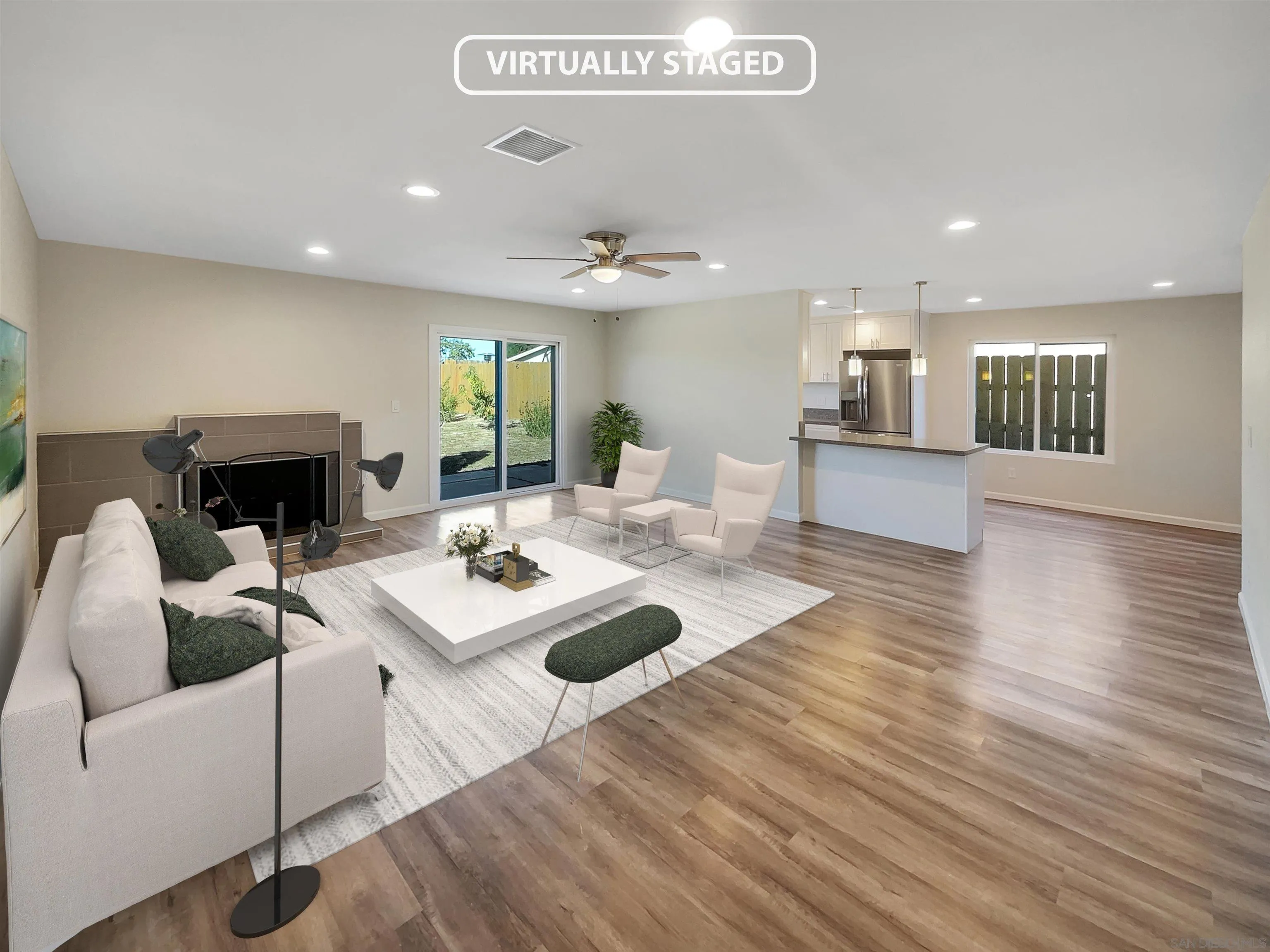 8238 Cacus Street Spring Valley, CA 91977 - Photo 2 of 22 a living room with furniture and a fireplace