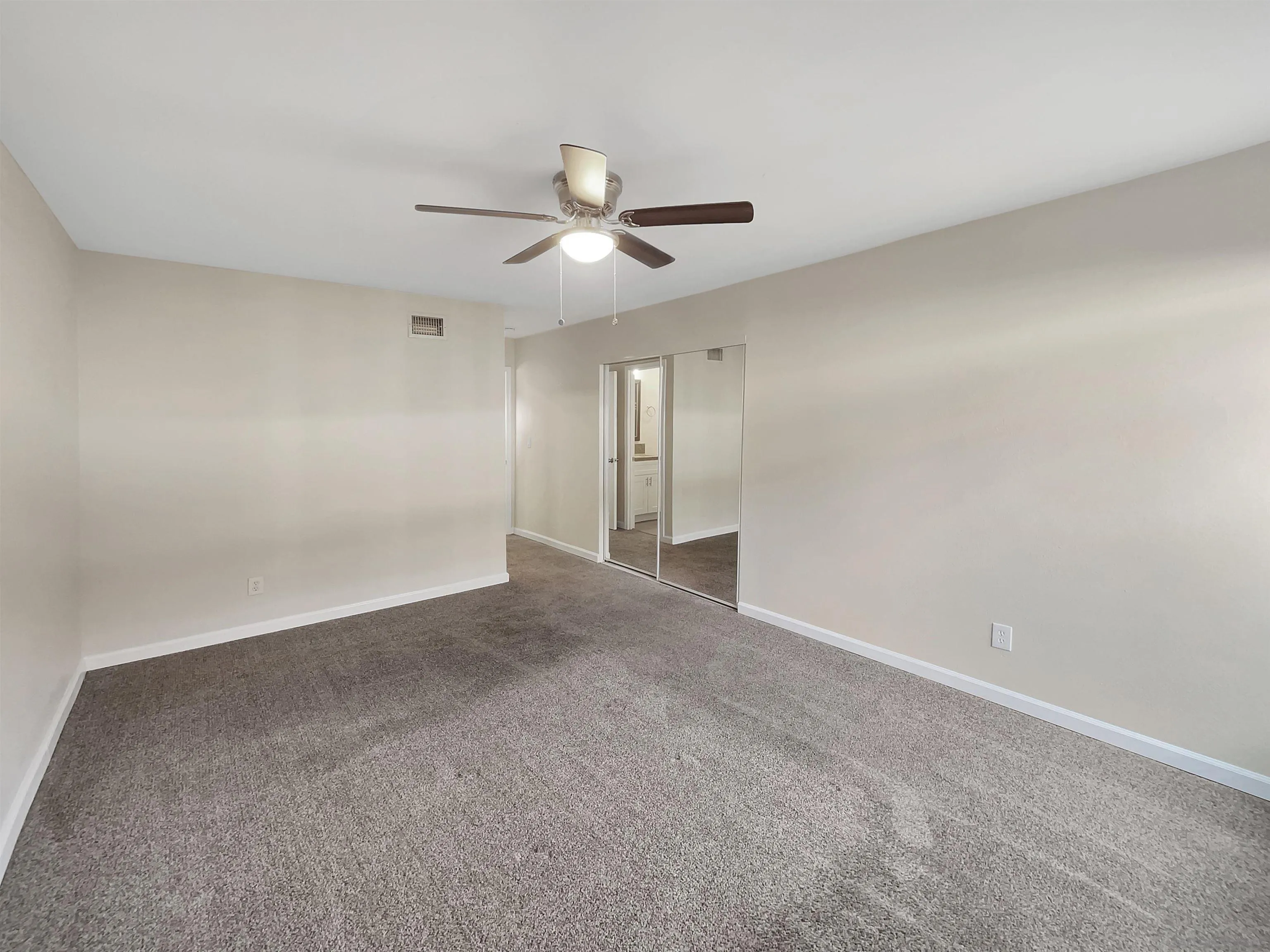8238 Cacus Street Spring Valley, CA 91977 - Photo 5 of 22 an empty room with ceiling fan and window
