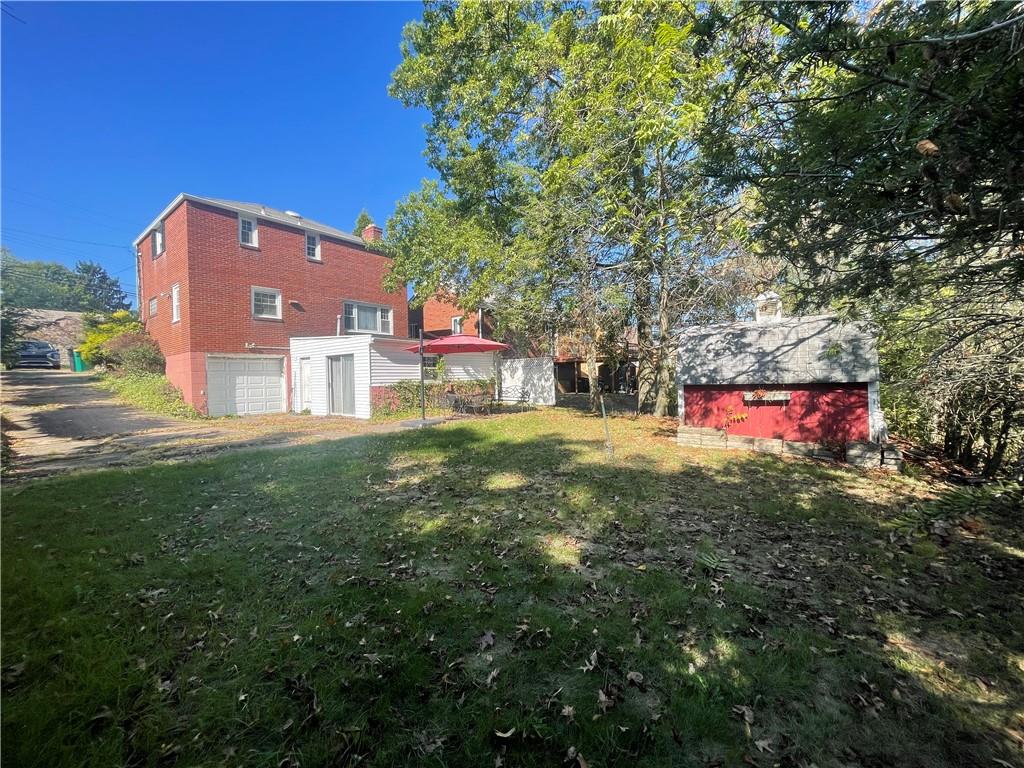 1018 Grandview Avenue Pittsburgh, PA 15237 - Photo 29 of 29 a backyard of a house with table and chairs