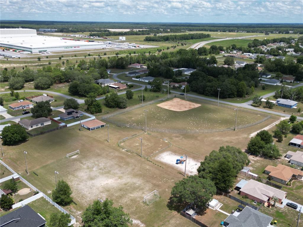 4750 Southwest 141st Lane Ocala, FL 34473 - Photo 1 of 1 an aerial view of residential houses with outdoor space and swimming pool