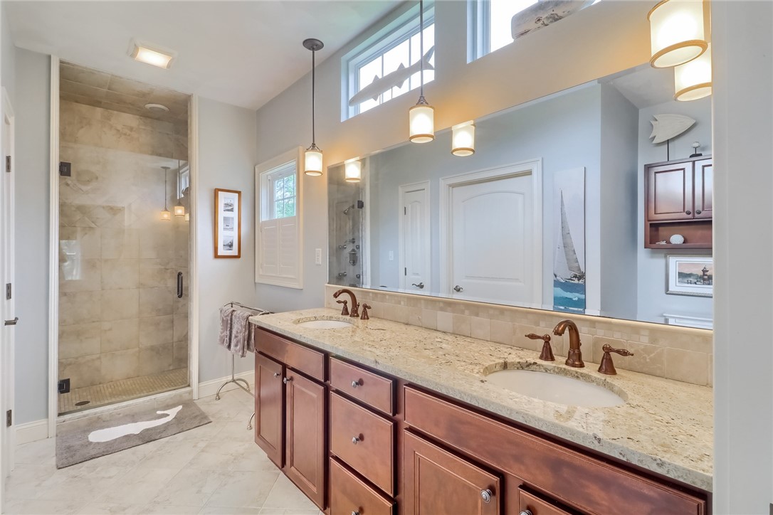 70 Whispering Pine Way, Unit 70 Exeter, RI 02822 - Photo 15 of 21 Double sinks and a walk in shower