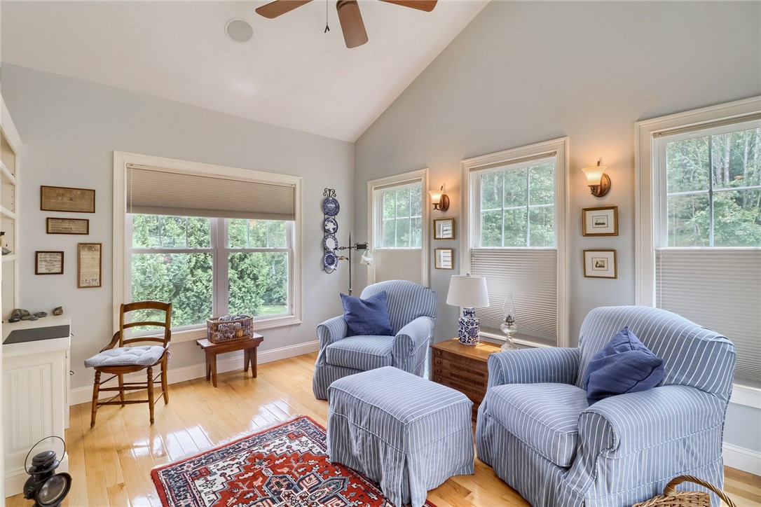 70 Whispering Pine Way, Unit 70 Exeter, RI 02822 - Photo 7 of 21 Den also known as the sunroom. Notice the built-in desk and bookcases.