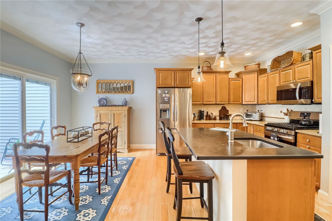 70 Whispering Pine Way, Unit 70 Exeter, RI 02822 - Photo 9 of 21 Wonderful kitchen and dining area with sliders to the deck