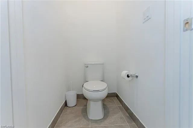 a view of an empty room and a window