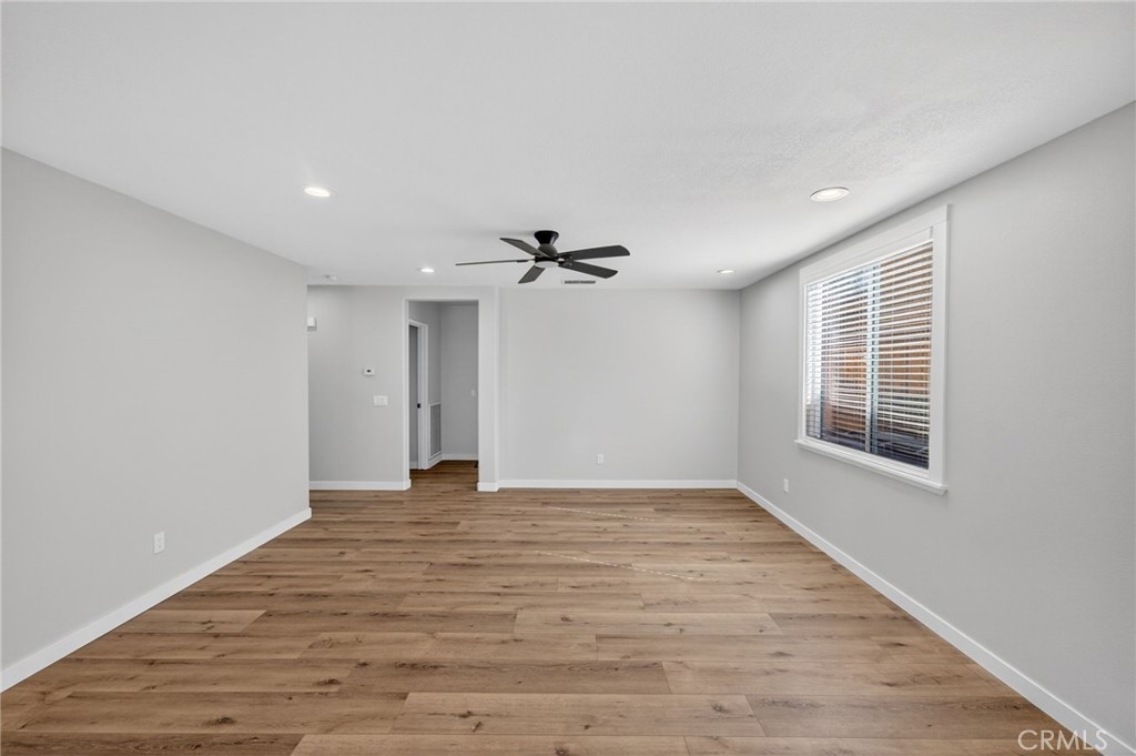 44797 Corte Sanchez Temecula, CA 92592 - Photo 11 of 58 a view of empty room with wooden floor and fan