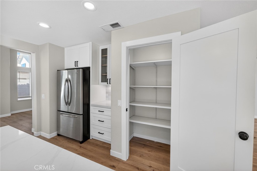 44797 Corte Sanchez Temecula, CA 92592 - Photo 20 of 58 a view of a refrigerator in a kitchen