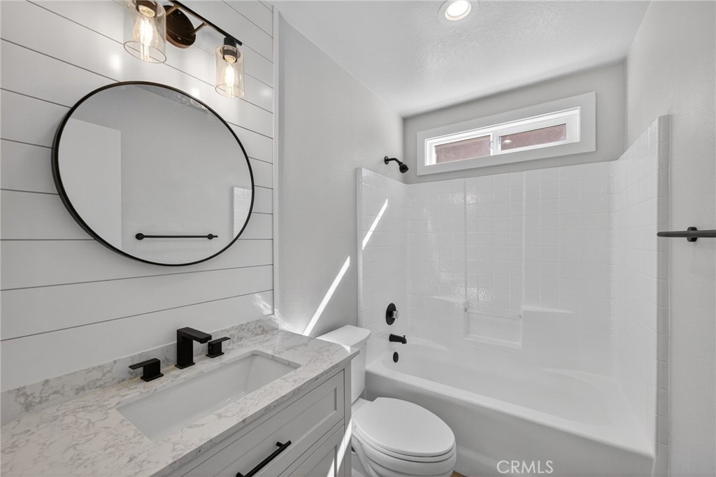 44797 Corte Sanchez Temecula, CA 92592 - Photo 21 of 58 a bathroom with a sink a toilet and a mirror
