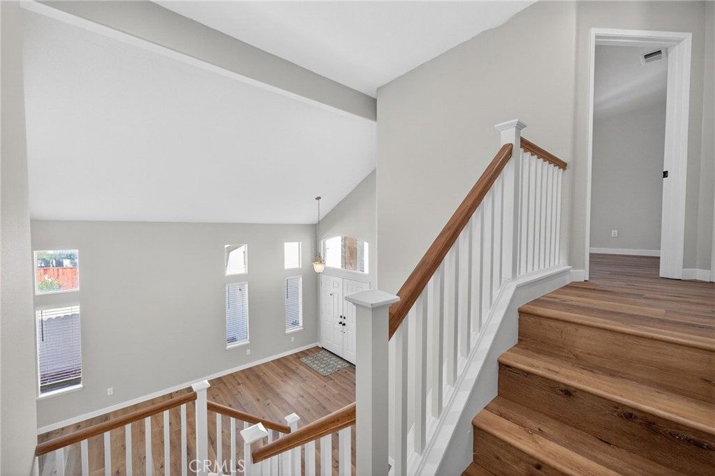 44797 Corte Sanchez Temecula, CA 92592 - Photo 23 of 58 a view of staircase with lots of frames on wall and a window