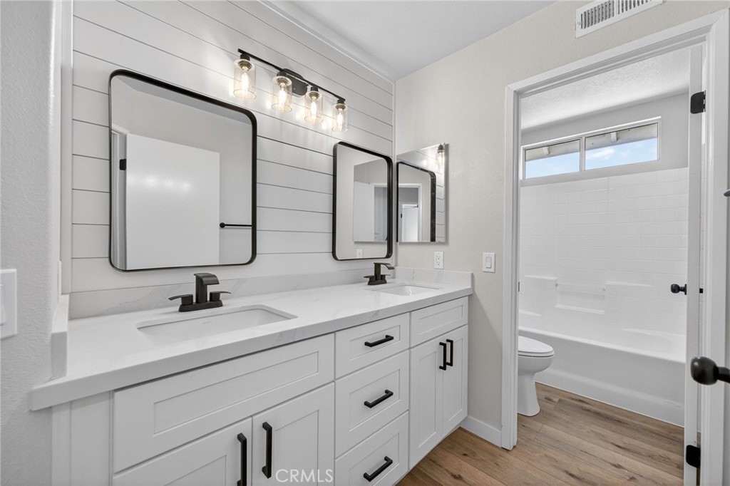 44797 Corte Sanchez Temecula, CA 92592 - Photo 24 of 58 a bathroom with a double vanity sink mirror and