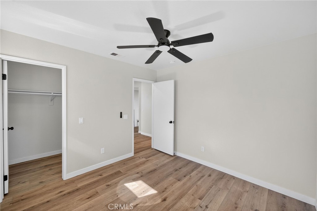 44797 Corte Sanchez Temecula, CA 92592 - Photo 31 of 58 a view of empty room with wooden floor