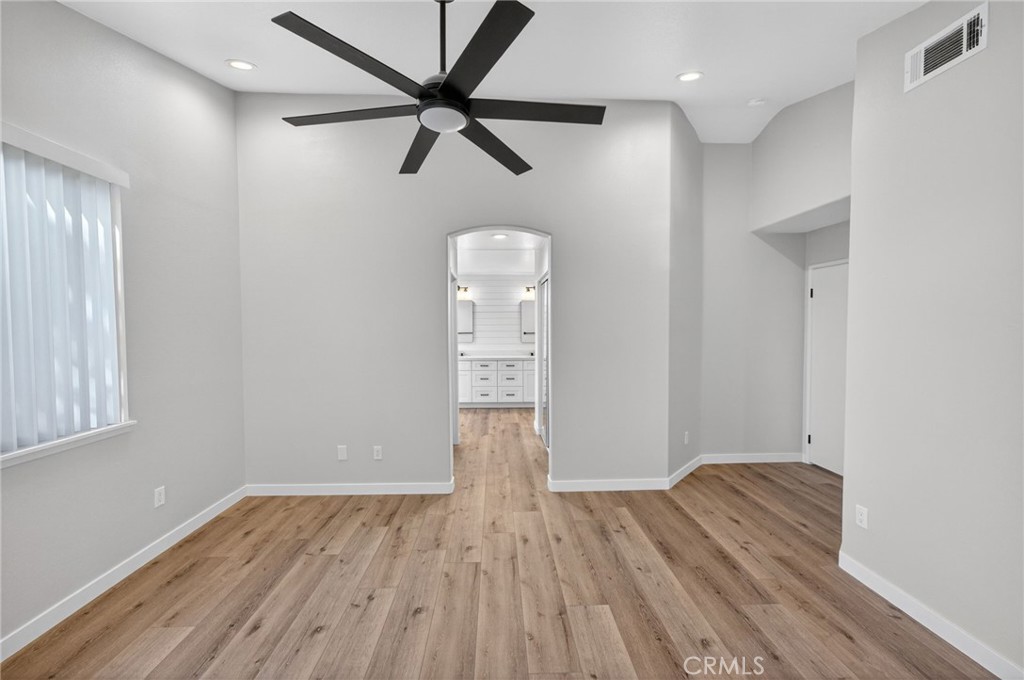 44797 Corte Sanchez Temecula, CA 92592 - Photo 36 of 58 a view of empty room with wooden floor and fan