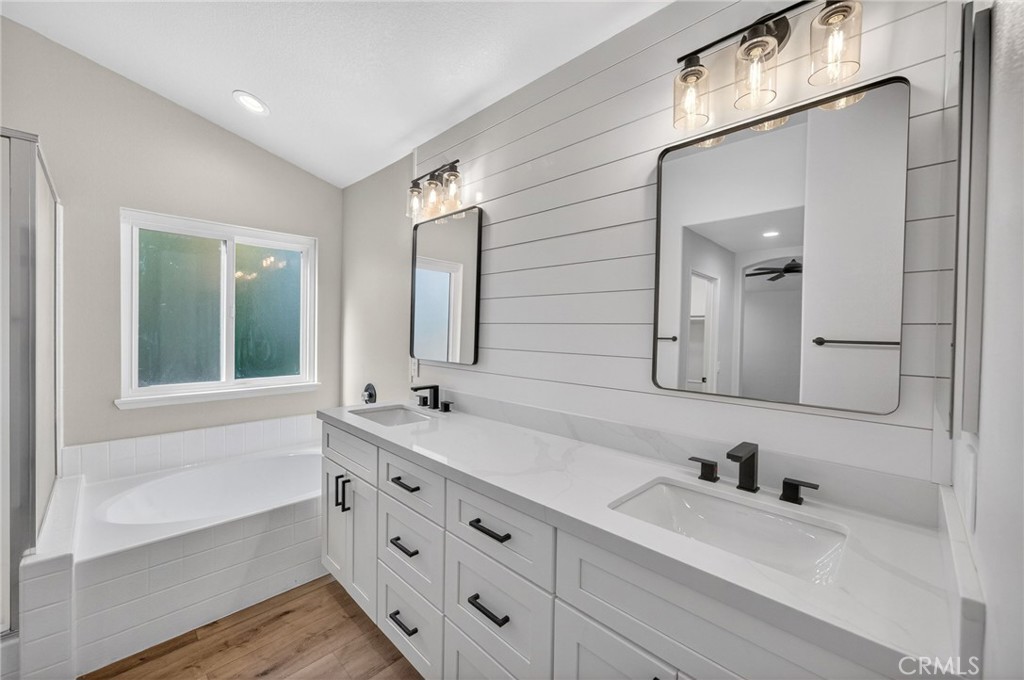 44797 Corte Sanchez Temecula, CA 92592 - Photo 39 of 58 a bathroom with a tub sink and mirror