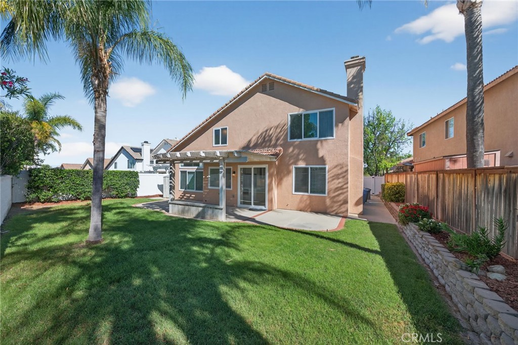 44797 Corte Sanchez Temecula, CA 92592 - Photo 44 of 58 a view of a house with a yard and a patio