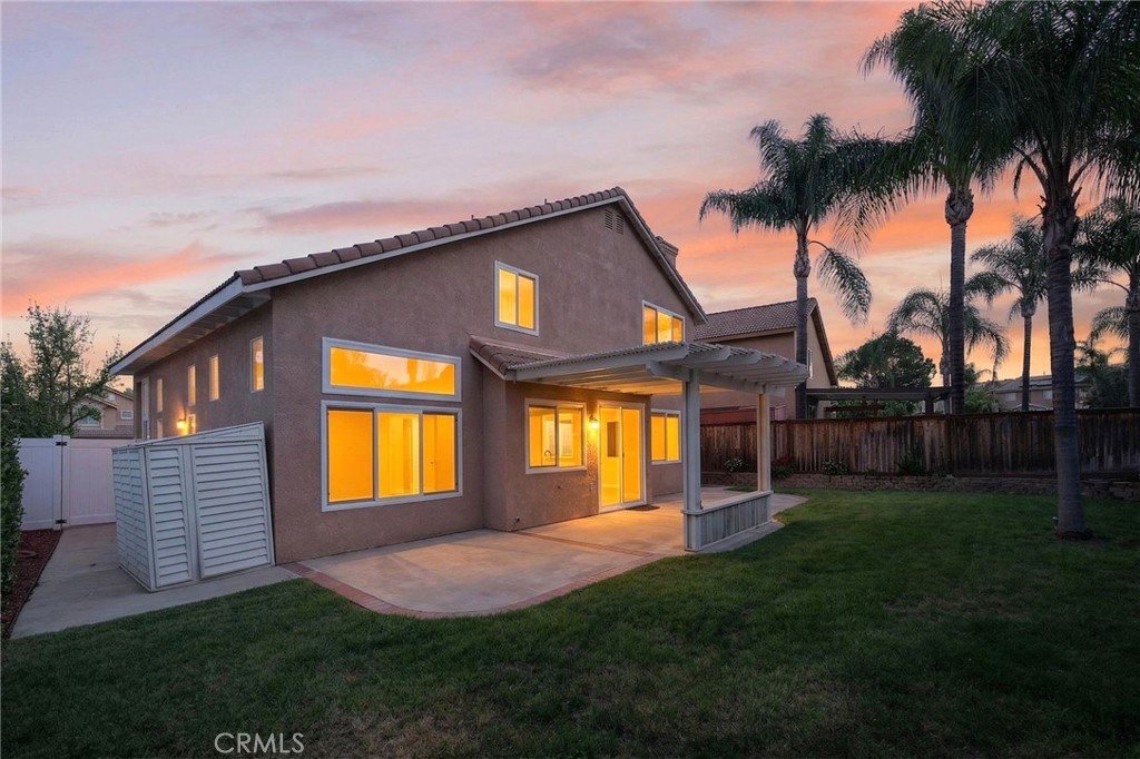 44797 Corte Sanchez Temecula, CA 92592 - Photo 49 of 58 a front view of a house with a garden and yard