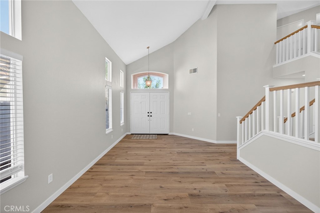 44797 Corte Sanchez Temecula, CA 92592 - Photo 6 of 58 a view of an entryway with wooden floor