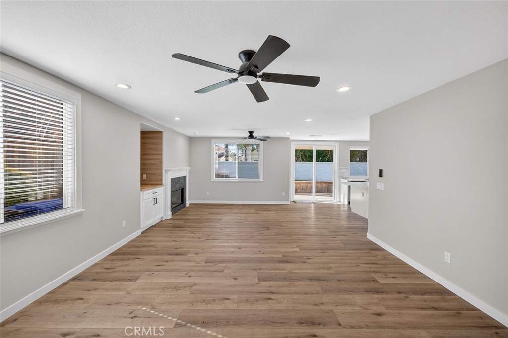 44797 Corte Sanchez Temecula, CA 92592 - Photo 10 of 58 a view of an empty room with window and wooden floor