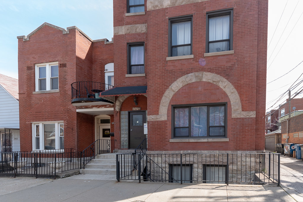 2347 West 24th Place, Unit 1R Chicago, IL 60608 - Photo 1 of 21 a front view of a building with glass windows
