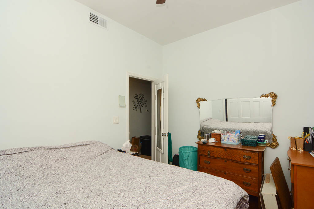 2347 West 24th Place, Unit 1R Chicago, IL 60608 - Photo 14 of 21 a bedroom with a bed and a closet
