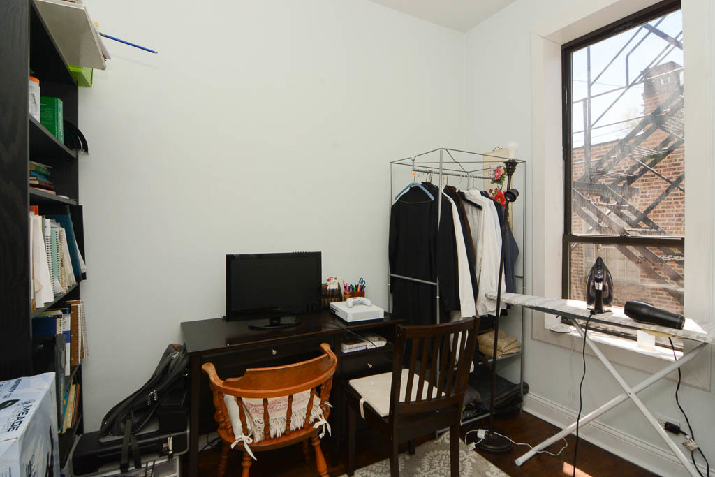 2347 West 24th Place, Unit 1R Chicago, IL 60608 - Photo 16 of 21 a view of a workspace with furniture and a window