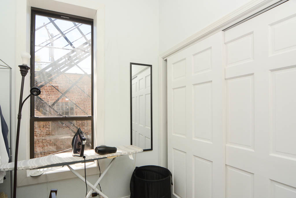 2347 West 24th Place, Unit 1R Chicago, IL 60608 - Photo 17 of 21 a bathroom with a sink and a mirror