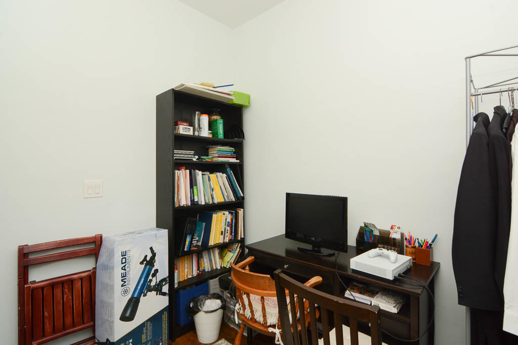 2347 West 24th Place, Unit 1R Chicago, IL 60608 - Photo 18 of 21 a workspace with furniture and book shelf