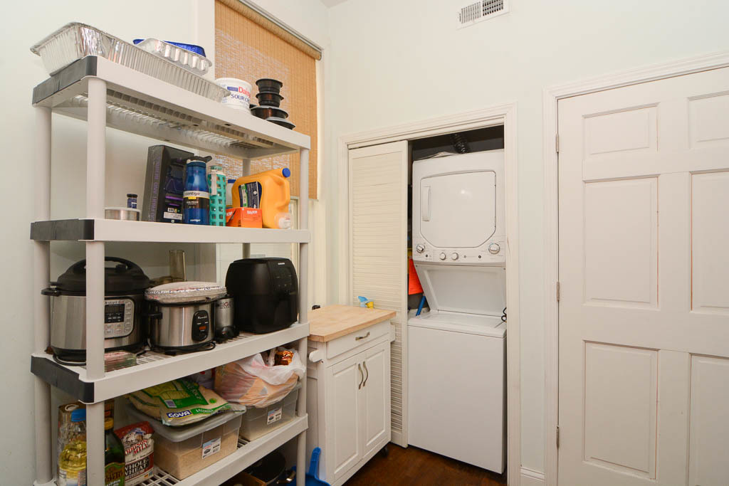 2347 West 24th Place, Unit 1R Chicago, IL 60608 - Photo 5 of 21 a kitchen with a refrigerator and a stove