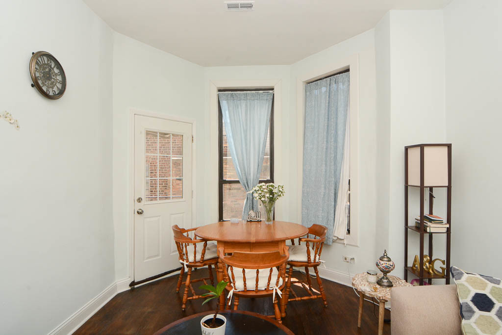 2347 West 24th Place, Unit 1R Chicago, IL 60608 - Photo 8 of 21 a dining room with furniture and window