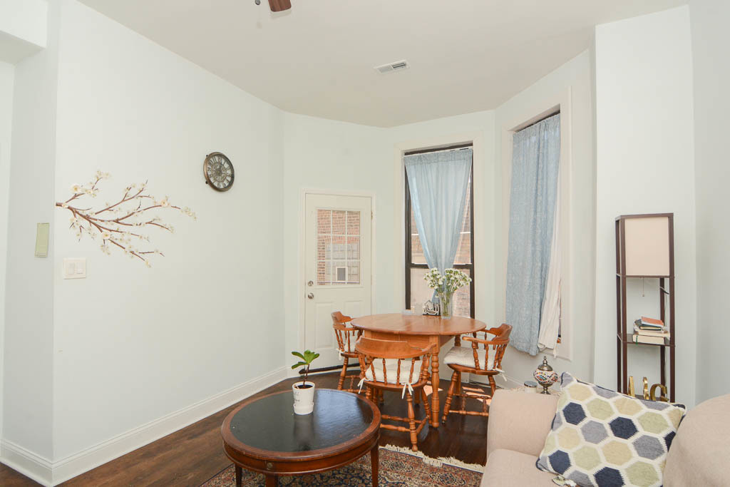 2347 West 24th Place, Unit 1R Chicago, IL 60608 - Photo 9 of 21 a view of a room with furniture and wooden floor