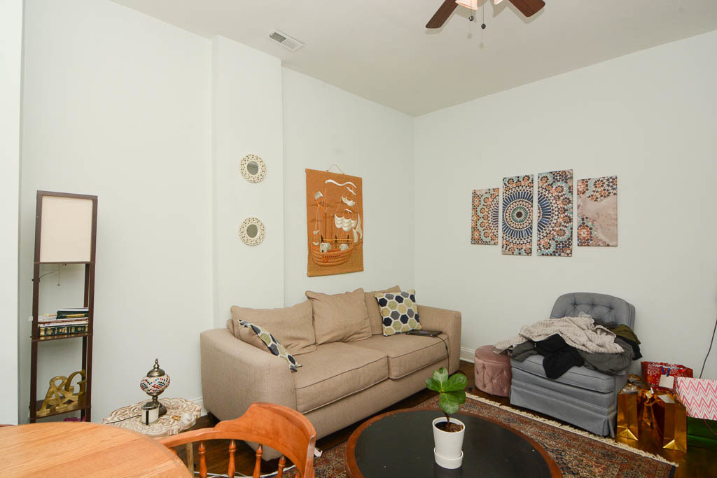 2347 West 24th Place, Unit 1R Chicago, IL 60608 - Photo 10 of 21 a living room with furniture and a window
