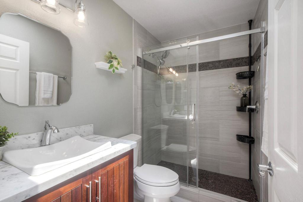 4710 Majorca Way Oceanside, CA 92056 - Photo 27 of 42 Hall bathroom with walk-in shower