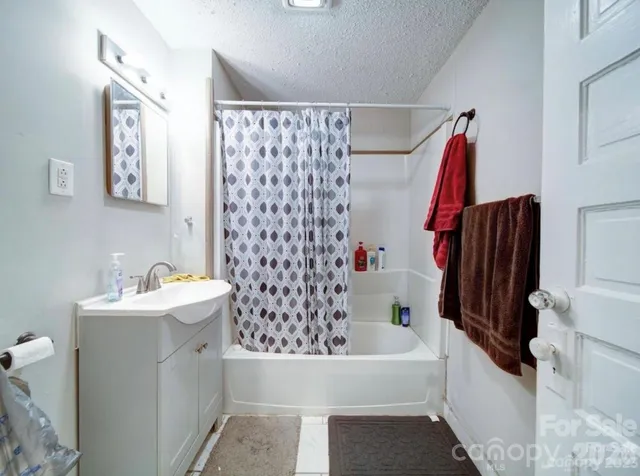 a bathroom with a sink and a bathtub