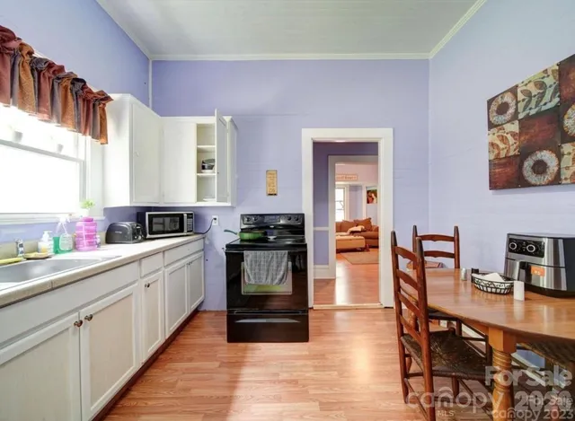 a kitchen with stainless steel appliances granite countertop a refrigerator and sink