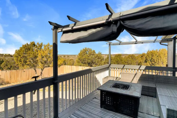 a view of a balcony with furniture