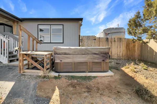 a view of a wooden house with a bench
