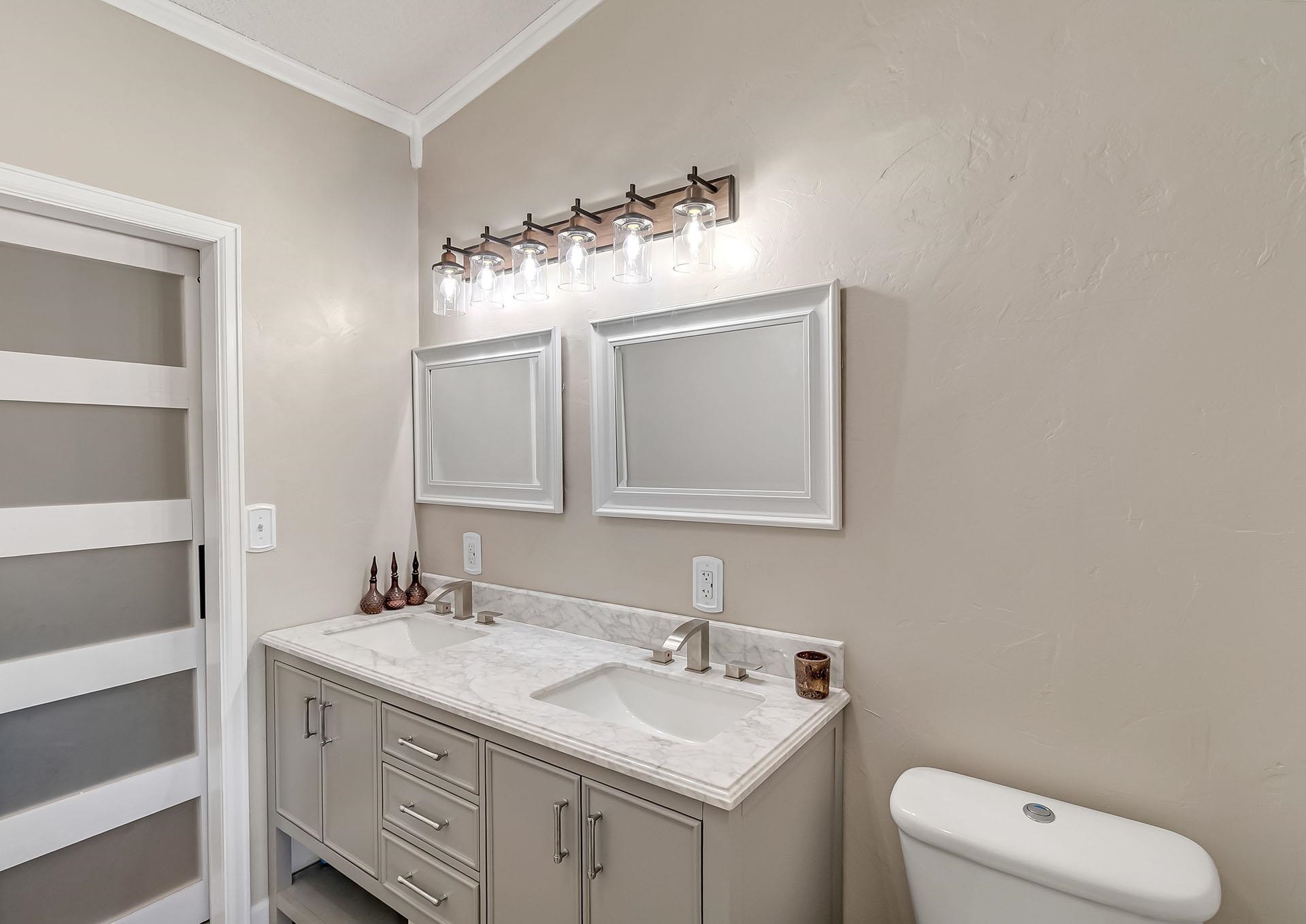 13090 Bs Road Glade Park, CO 81523 - Photo 20 of 40 a bathroom with a toilet sink and mirror