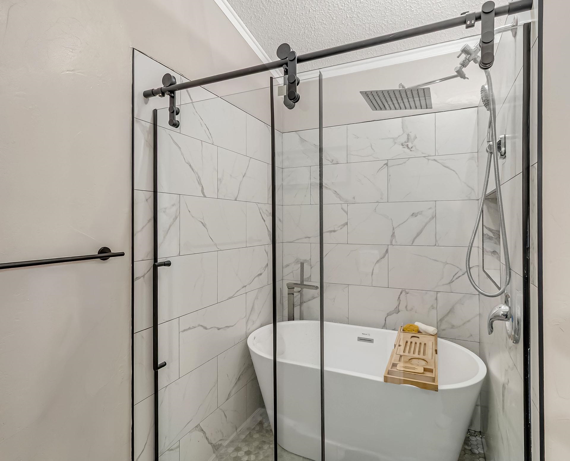 13090 Bs Road Glade Park, CO 81523 - Photo 21 of 40 a bathroom with a bathtub and a shower