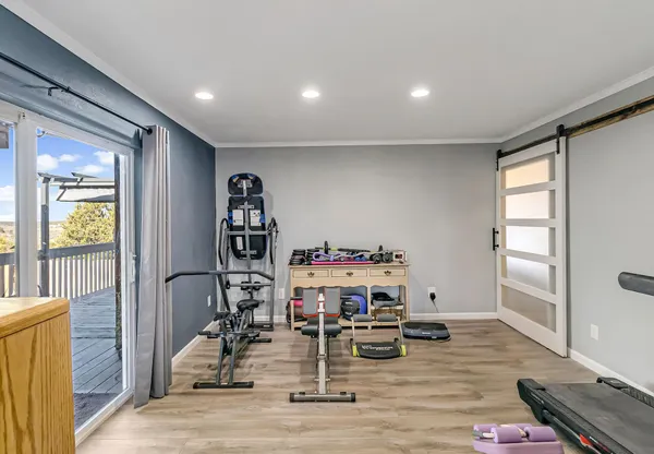 a living room with lots of furniture and a chandelier