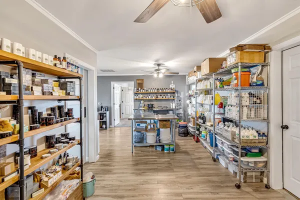 a utility room with lots of appliances and furniture