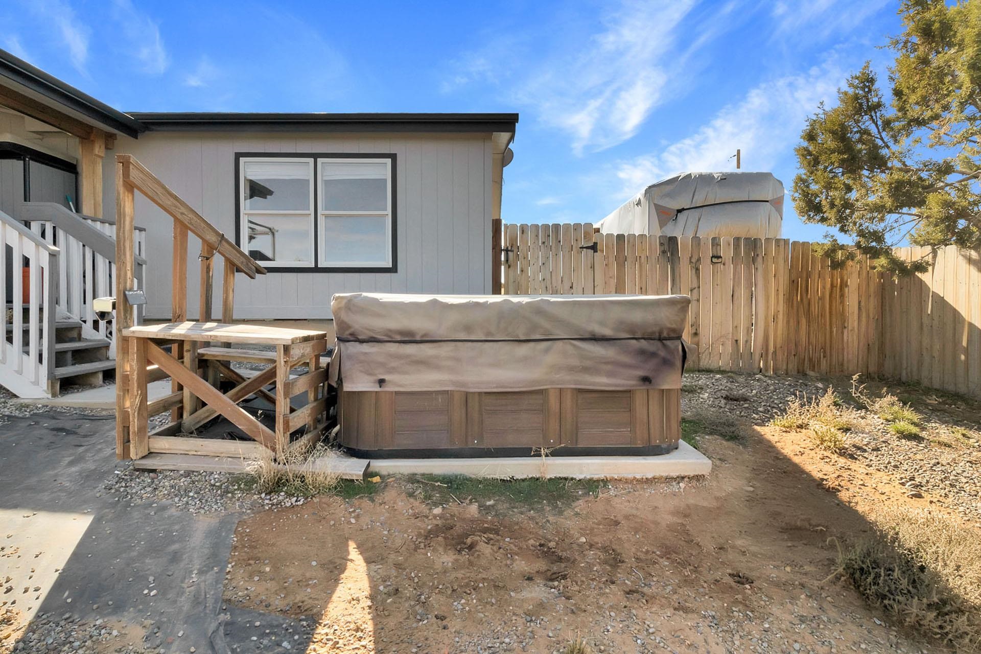 13090 Bs Road Glade Park, CO 81523 - Photo 35 of 40 a view of a wooden house with a bench