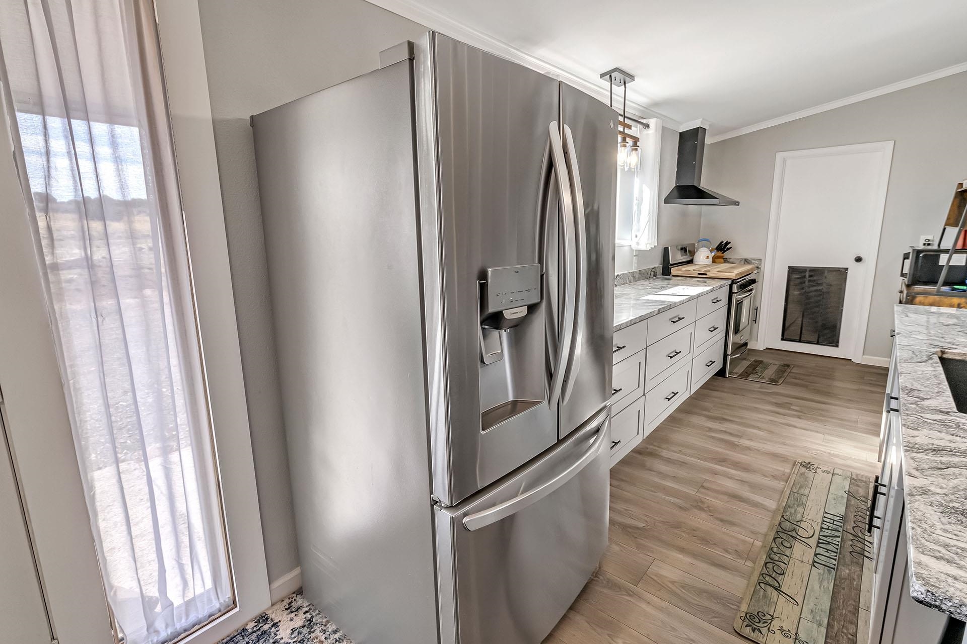 13090 Bs Road Glade Park, CO 81523 - Photo 7 of 40 a kitchen with stainless steel appliances a refrigerator and cabinets