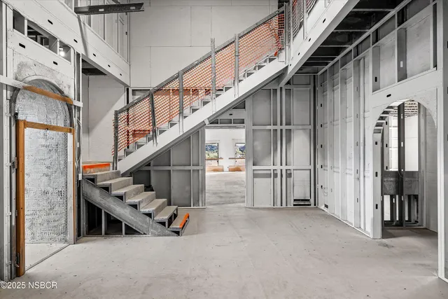 a view of an empty room with a garage