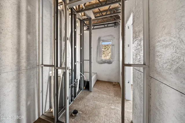 a view of an empty room with stairs