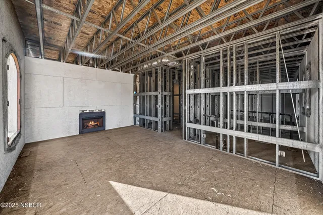 a view of an empty room with a furniture