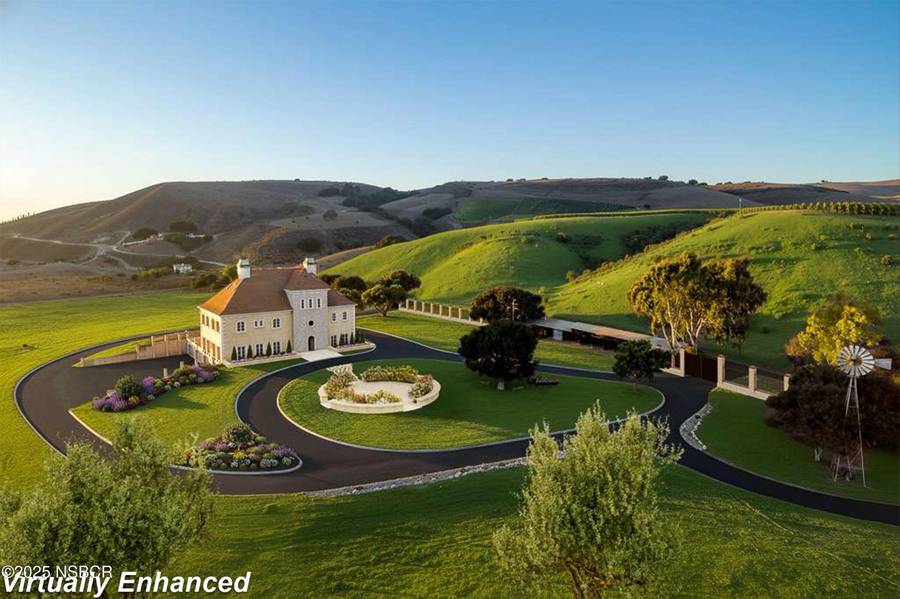 4375 Sweeney Road Lompoc, CA 93436 - Photo 4 of 74 an aerial view of a house with a garden and lake view
